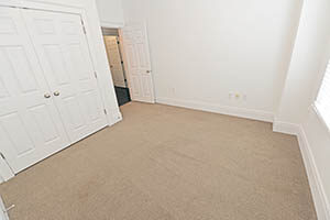 The Kirkwood, Uptown Senate, bedroom 2 comes with a spacious closet and large window.